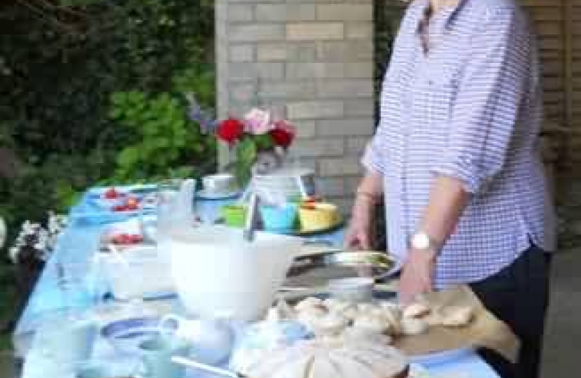 Pamela Douglas serving strawberries and cream.