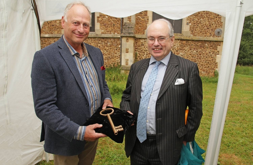 Councillor Nick Wright (left), South Cambridgeshire District Council’s deputy leader, handing over the key to St Denis' church East Hatley, Cambridgeshire to Roger Evans, chairman, Friends of Friendless Churches on 11th July 2017.