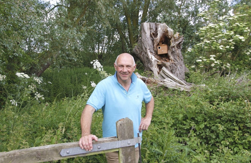 Tim Scott near a little barn owl nest box on Countryside Restoration Trust land in Barton, Cambridgeshire.