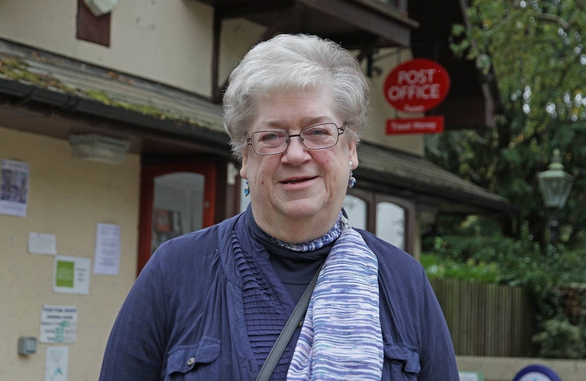 Barbara Kettel, the Conservative candidate for the Foxton ward in the South Cambridgeshire District Council elections on 3rd May 2018.  As a result of the boundary changes which take effect from May, Foxton goes from a two-village ward (Foxton and Fowlmere) to a ward covering five villages: Fowlmere, Foxton, Great Chishill, Heydon and Little Chishill.  Barbara is keen to bring people together and give them a voice to influence the future of their community and is seen here by Foxton’s village stores and pos