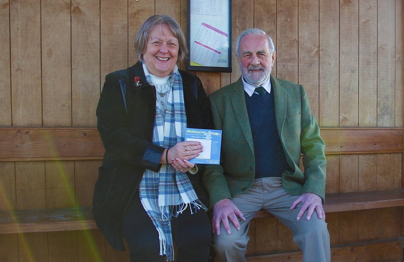 Irene Bloomfield and Mike Linnette in Whaddon’s bus shelter.  “It’s a nice shelter,” said Irene.  “We need to see what we can do to have more buses coming to the village."