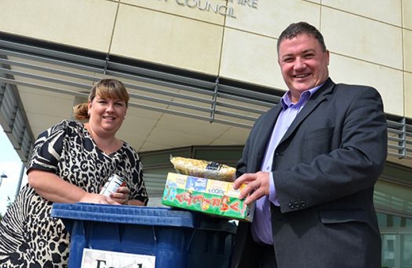 Cllr Mark Howell and Emma George at the new foodbank in SCDC's offices