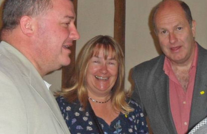 District Councillor Mark Howell. left, with Keith and Andrea Rowlands