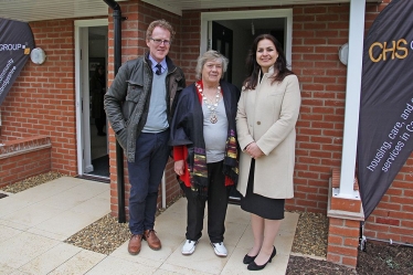 South Cambs Councillors Peter Topping and Sue Ellington with Heidi Allen MP, in front of two of the eight new affordable houses in Newton Road, Whittlesford, 22 April 2016.